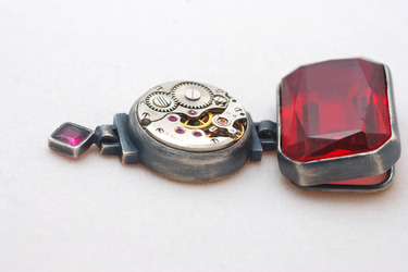unique pendant with clock and ruby